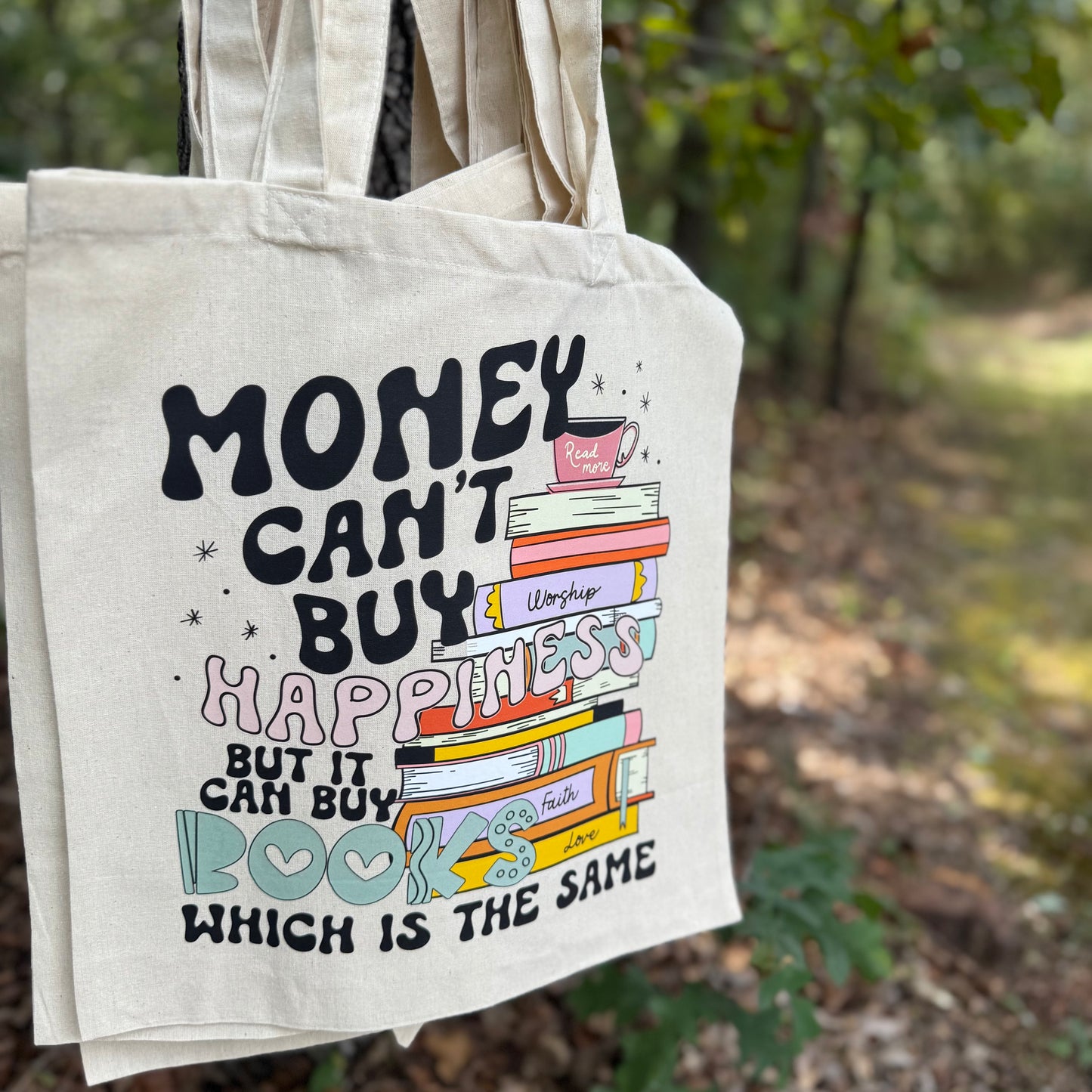 Money Can’t Buy Happiness, But It Can Buy Books Tote Bag